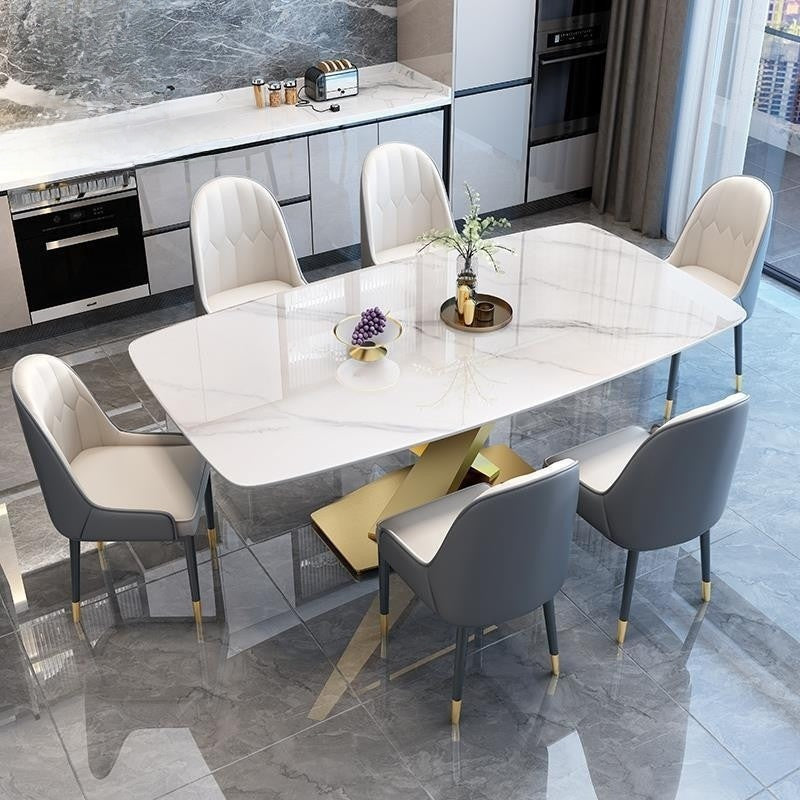 Italian dining table, luxurious, smooth surface, small artificial stone slab. Suitable for condos, stainless steel base, durable, modern.