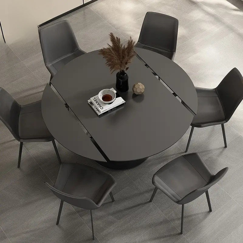 Meja batu tulis hitam moden yang ringkas dengan bahagian atas bulat yang boleh dipanjangkan, sesuai untuk mana-mana ruang makan.